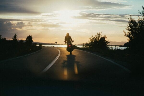 A motorcyclist enjoys the open road, knowing they have GPS and insurance to secure their ride