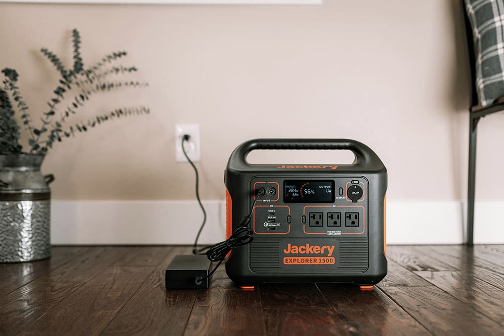 A power generator plugged in to an interior wall. 