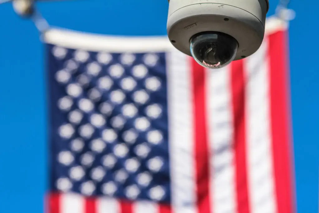 Security camera in front of an American flag